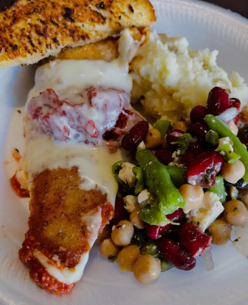 Breaded chicken parmesan with mashed potatoes and three-bean salad